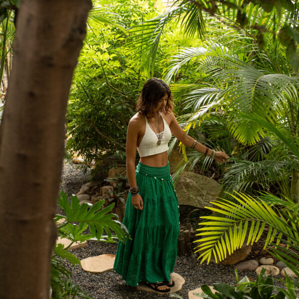 Model on walking path through thick jungle foliage at Tropic Shots production set